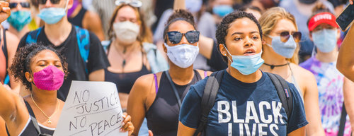 Crowd gathers to protest wearing face masks and black lives matter tshirts